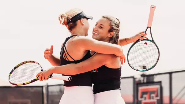 Elena Daskalova and Mariia Hlahola hug after winning their doubles match. Texas Tech vs Colorado women's tennis on March 28, 2026 in Lubbock, TX. (Photo by Gavin Daly/Texas Tech Athletics)