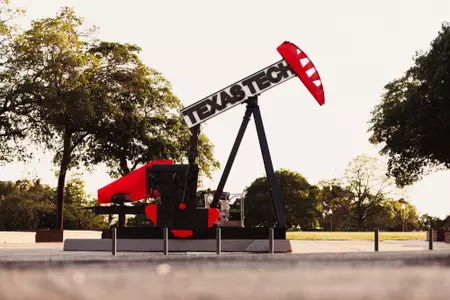 Photo of a Texas Tech-branded pumpjack located at the Green Space Area west of Jones AT&T Stadium.
