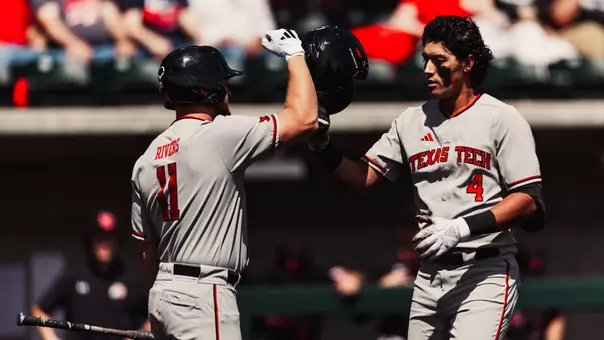 Linin Garcia and Davis Rivers celebrate Garcia's fourth inning home run Sunday afternoon at Utah
