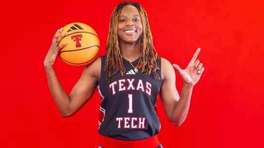 Rhema Collins poses with her guns up in a photoshoot.