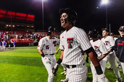 A smiling Linkin Garcia stands on the field after hitting a run-rule clinching single against Tarleton State Tuesday