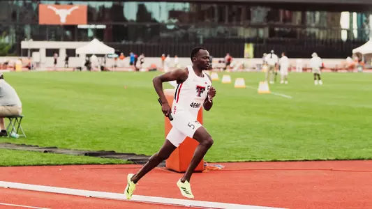 Stephen Mutai running with the baton