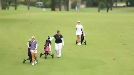 Lauren Zaretsky walks the course with competition at the Big 12 Championship