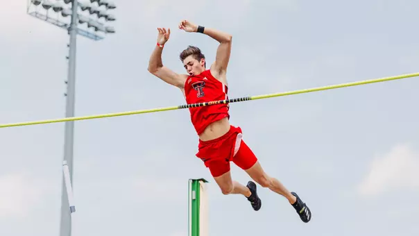Jackson Bragg clearing the bar in the pole vault