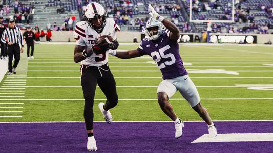 Caleb Douglas hauls in a touchdown pass in the end zone during Texas Tech's win at Kansas State.