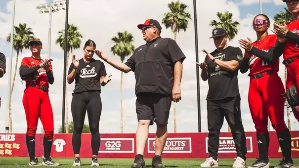 Gerry Glasco talking to texas tech softball as they are huddled up after a game