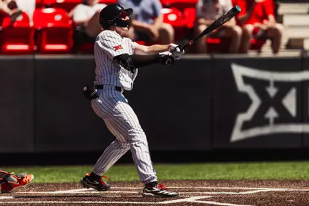Texas Tech OF Logan Hughes mashes a home run during Tech's Sunday contest against OSU
