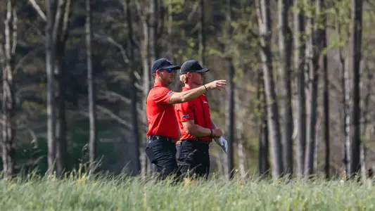 Head coach Greg Sands directing Brady McHenry's next shot