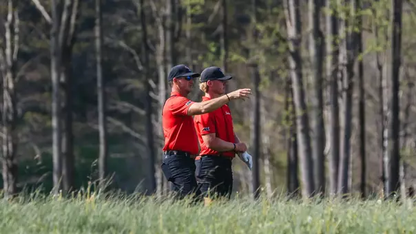 Head coach Greg Sands directing Brady McHenry's next shot