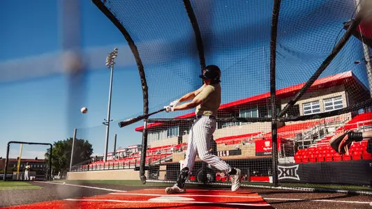 Caden Ferraro takes a swing during batting practice before the Red Raiders contest against Oklahoma State, Sunday April 26