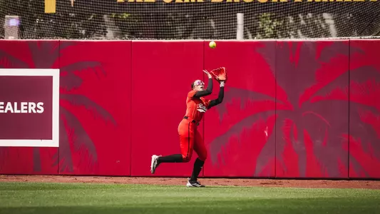 Makayla Garcia making a running catch in the outfield of a softball game against Arizona state