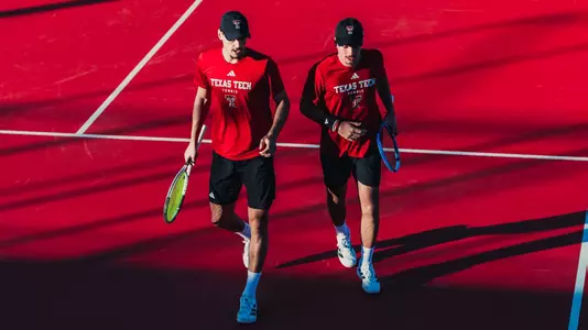 Niksa Arsic and Thiago Guglieri walking on the court during doubles. Texas Tech Tennis Red and Black scrimmage on January 8th, 2026 (Photo by Adele Clarke/Texas Tech Athletics)