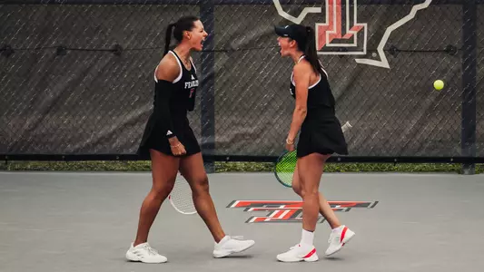 Yekaterina Dmitrichenko and Hailey Murphy celebrating after winning their doubles match. Texas Tech vs. Baylor Women's Tennis on April 11, 2026 in Lubbock, TX. (Photo by Joseph Cabrera/ Texas Tech Athletics)