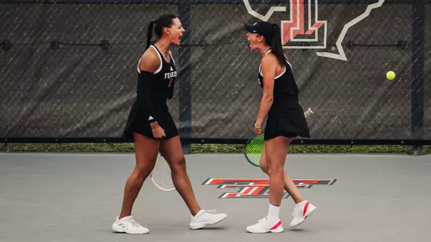 Yekaterina Dmitrichenko and Hailey Murphy celebrating after winning their doubles match. Texas Tech vs. Baylor Women's Tennis on April 11, 2026 in Lubbock, TX. (Photo by Joseph Cabrera/ Texas Tech Athletics)