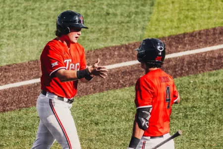 Caden Ferraro claps his hands after scoring in the bottom of the seventh Friday against UH