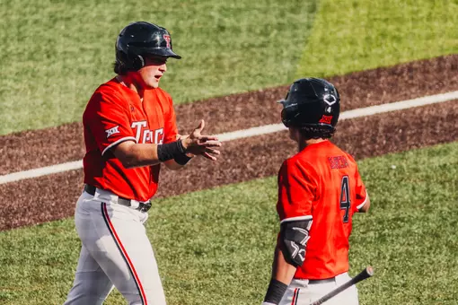 Caden Ferraro claps his hands after scoring in the bottom of the seventh Friday against UH