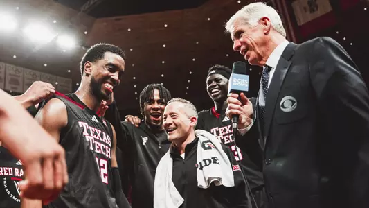 Donovan Atwell and Grant McCasland talk with a CBS reporter after earning a win at No. 4 Iowa State.