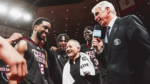Donovan Atwell and Grant McCasland talk with a CBS reporter after earning a win at No. 4 Iowa State.