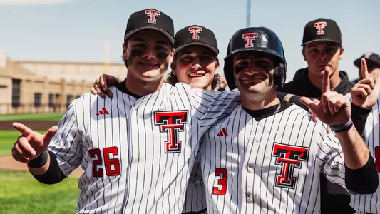 Catcher Matt Quintanar and Infielder Tracer Lopez smile for the camera after Tech's 11-2 win over UH