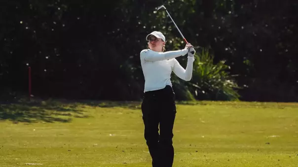Maja Ambroziak striking an iron shot in Florida