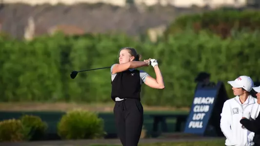 Maja Ambroziak hits an approach shot during a 2025-26 season tournament