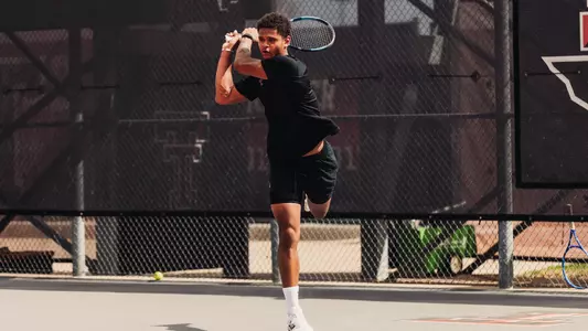 Thomas Van Den Dooren hitting a backhand.