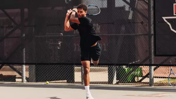 Thomas Van Den Dooren hitting a backhand.