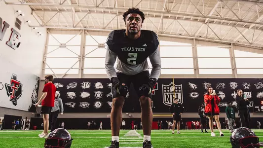Trey White warming up in the indoor turf practice area