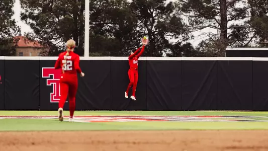 Mihyia Davis in center field jumping to make a catch to rob a home ru