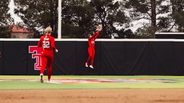 Mihyia Davis in center field jumping to make a catch to rob a home ru