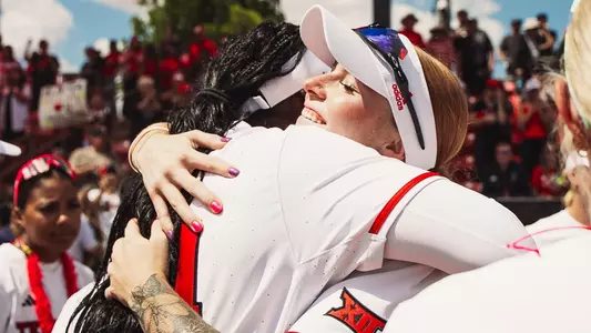 Terry and Canady sharing a hug after clinching the BIg 12 regular season title