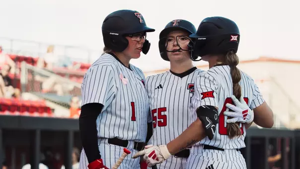 Kaitlyn Terry, Taylor Pannell and Jackie Lis celebrating at home plate after a home run
