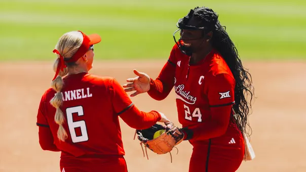 NiJaree Canady and Taylor Pannell sharing a handshake at the pitching circle