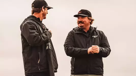Nathan Weant standing with Greg Sands