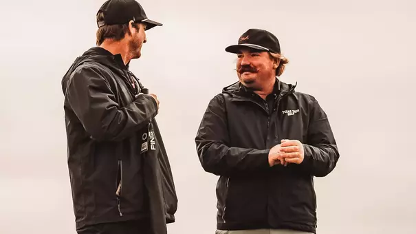 Nathan Weant standing with Greg Sands