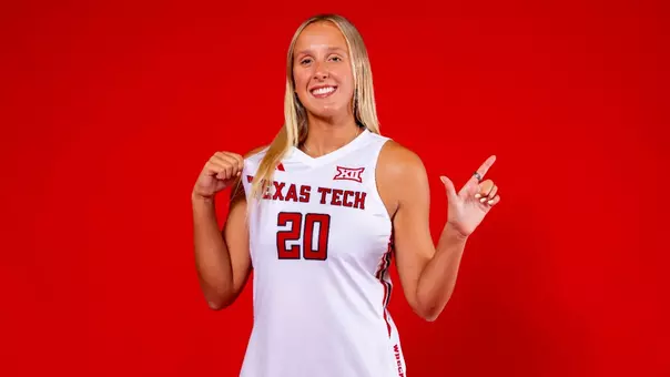 Maggie Boyd posing for a photo with the guns up