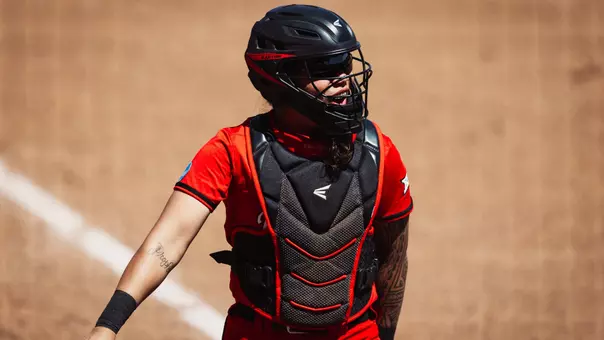 Lagi Quiroga in catchers gear getting ready for the softball game