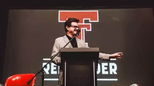 President Lawrence Schovanec addresses a soldout Red Raider Club luncheon crowd prior to the 2025 season.