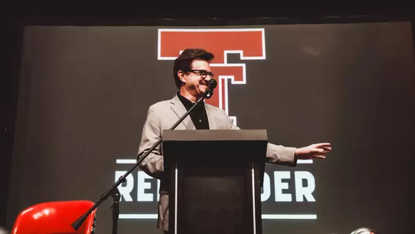 President Lawrence Schovanec addresses a soldout Red Raider Club luncheon crowd prior to the 2025 season.