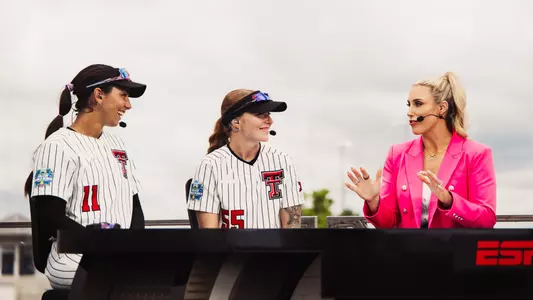 Texas Tech's Lauren Allred and Kaitlyn Terry smile during a postgame interview on the ESPN set following the Red Raiders' WCWS-opening win over Mississippi State.