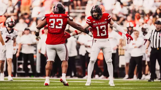 Holmes and Roberts celebrate
