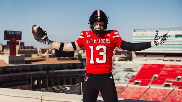 Ben Roberts shows off Texas Tech's new uniforms from atop the East Stadium Building of Jones AT&T Stadium.