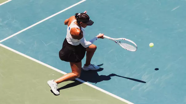 Yekaterina Dmitrichenko hits a forehand against Texas.