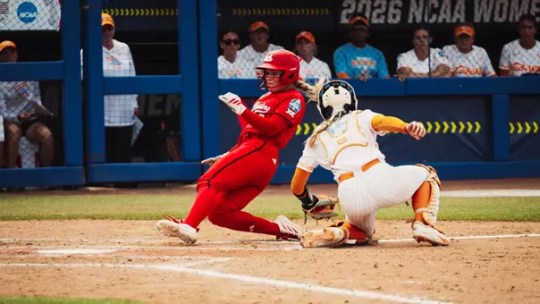 Taylor Pannell slides in safely to score a run against Tennessee at the WCWS.