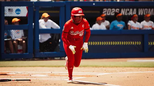 Mihyia Davis hits a single against Tennessee at the Women's College World Series.