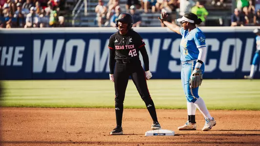 Mihyia Davis celebrates after hitting a double against UCLA in the Women's College World Series.