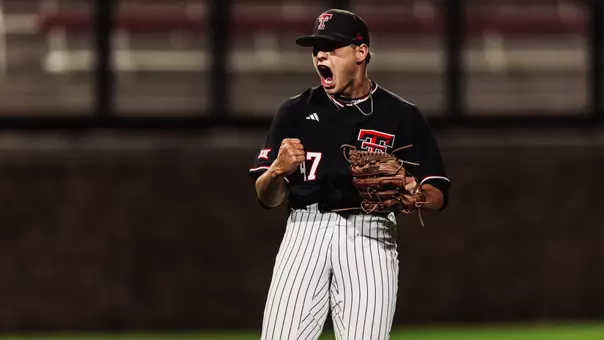 Logan Addison screams in celebration following closing out the Red Raiders 2-1 win over BYU