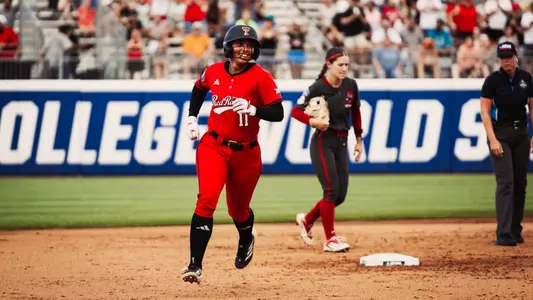 Lauren Allred jogs around the bases after hitting a solo home run against Alabama in the Women's College World Series.