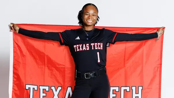 Moriah Polar posing with a Texas Tech flag on a recruiting visit to Lubbock