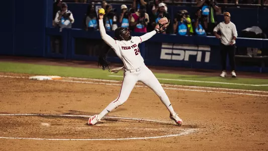 NiJaree Canady throwing a pitch in the women's college world series